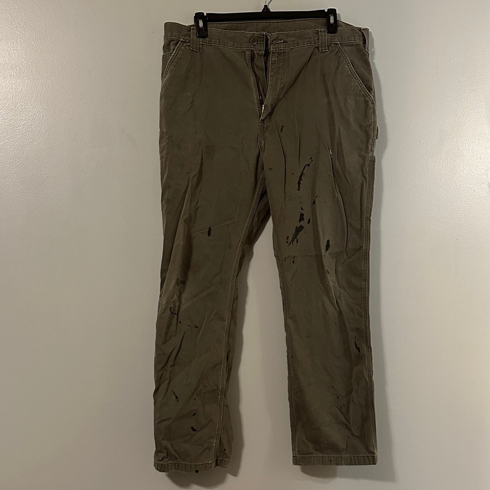 Very worn and distressed Carhartt Men's Olive carpenter pants